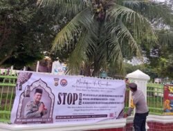 Personel Polres Bireuen Pasang Spanduk Imbauan Larangan Balap Liar dan Bakar Petasan