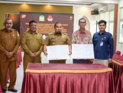 Pj Bupati Aceh Besar dan KIP Aceh Tandatangani NPHD